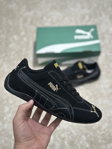 Puma shoes black gold
