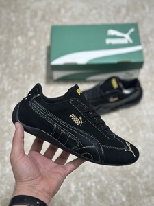 Puma shoes black gold